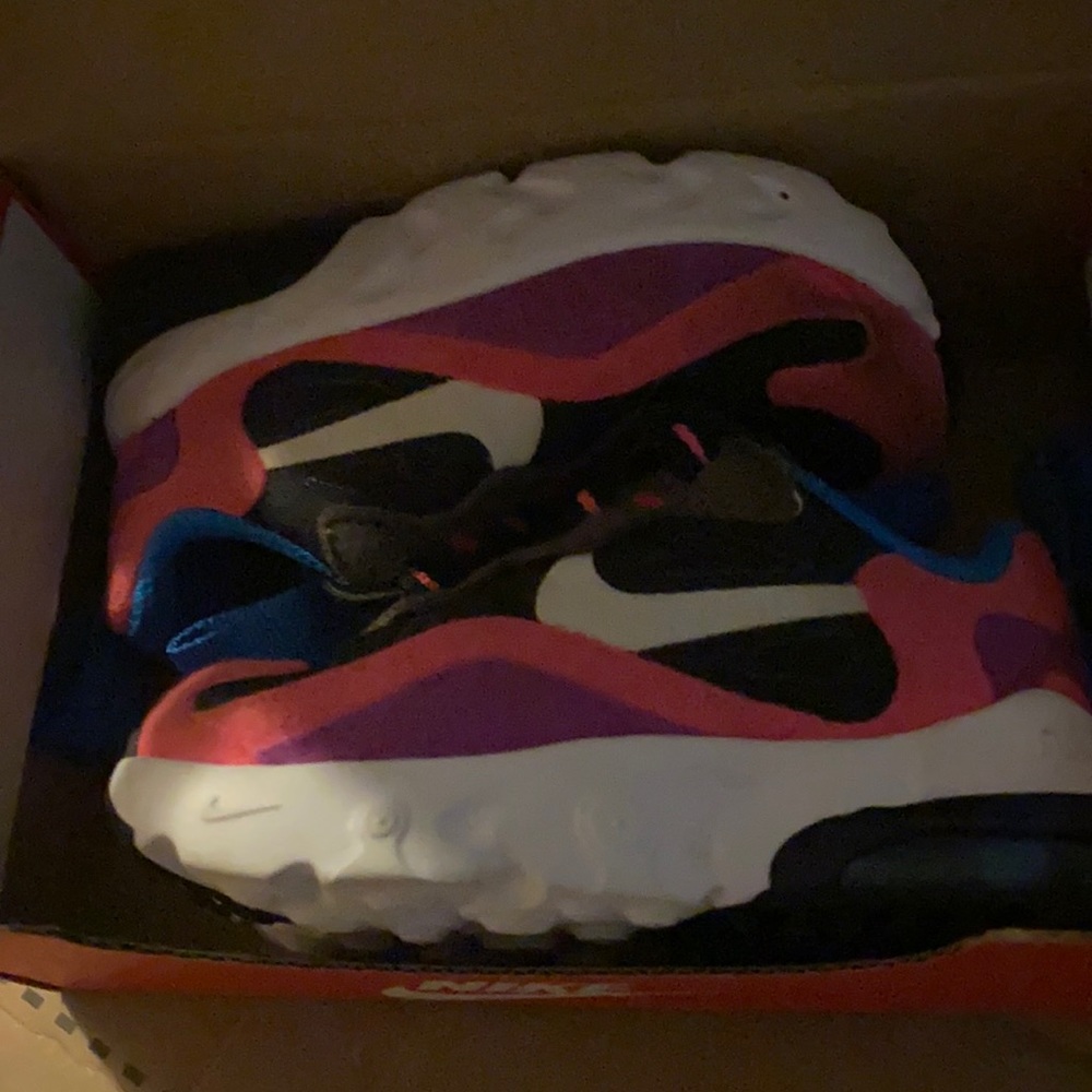Baby pink black and white and blue nikes